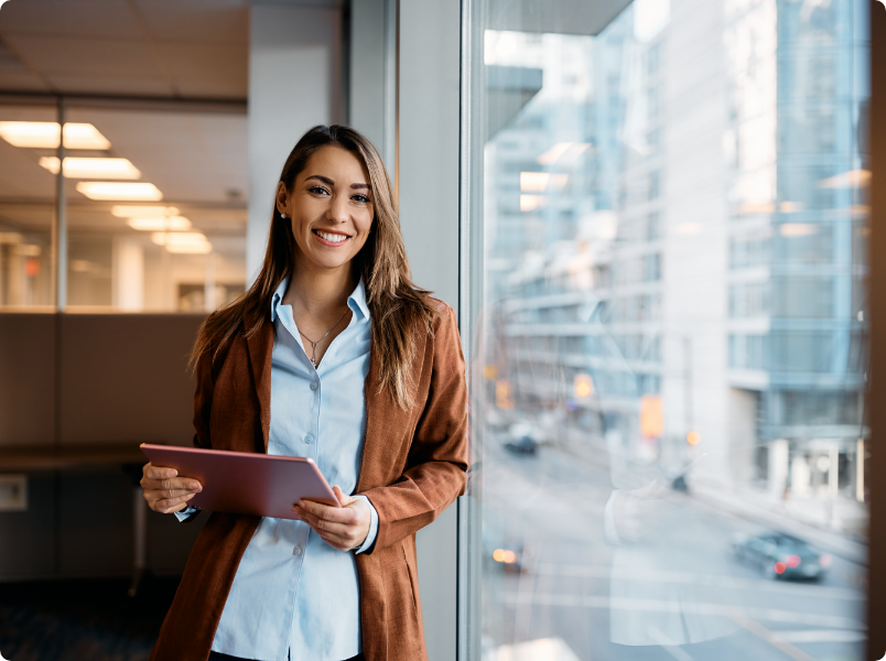 Woman smiling holding tablet