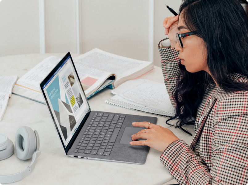 Woman looking at laptop