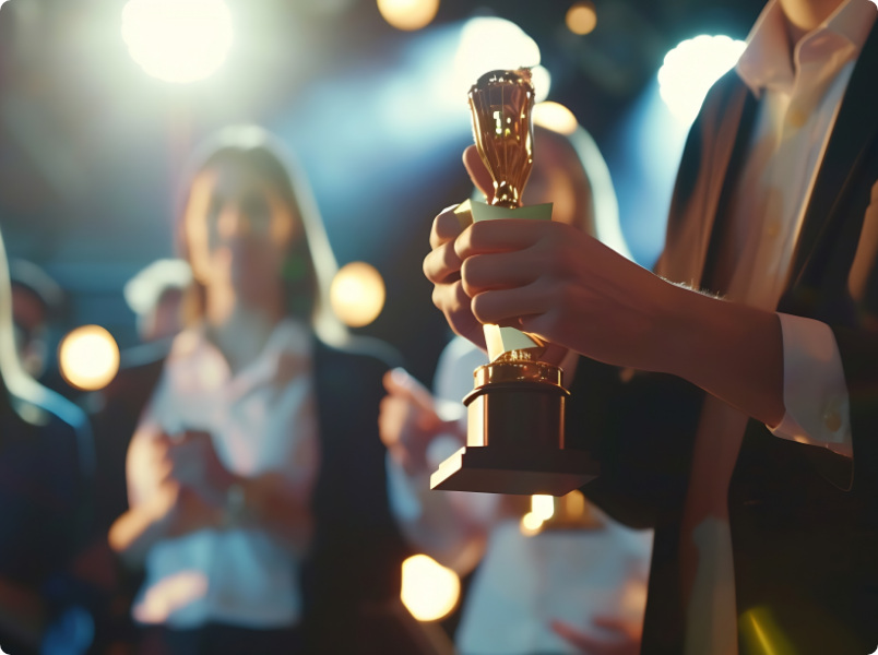 Close up of hands holding award